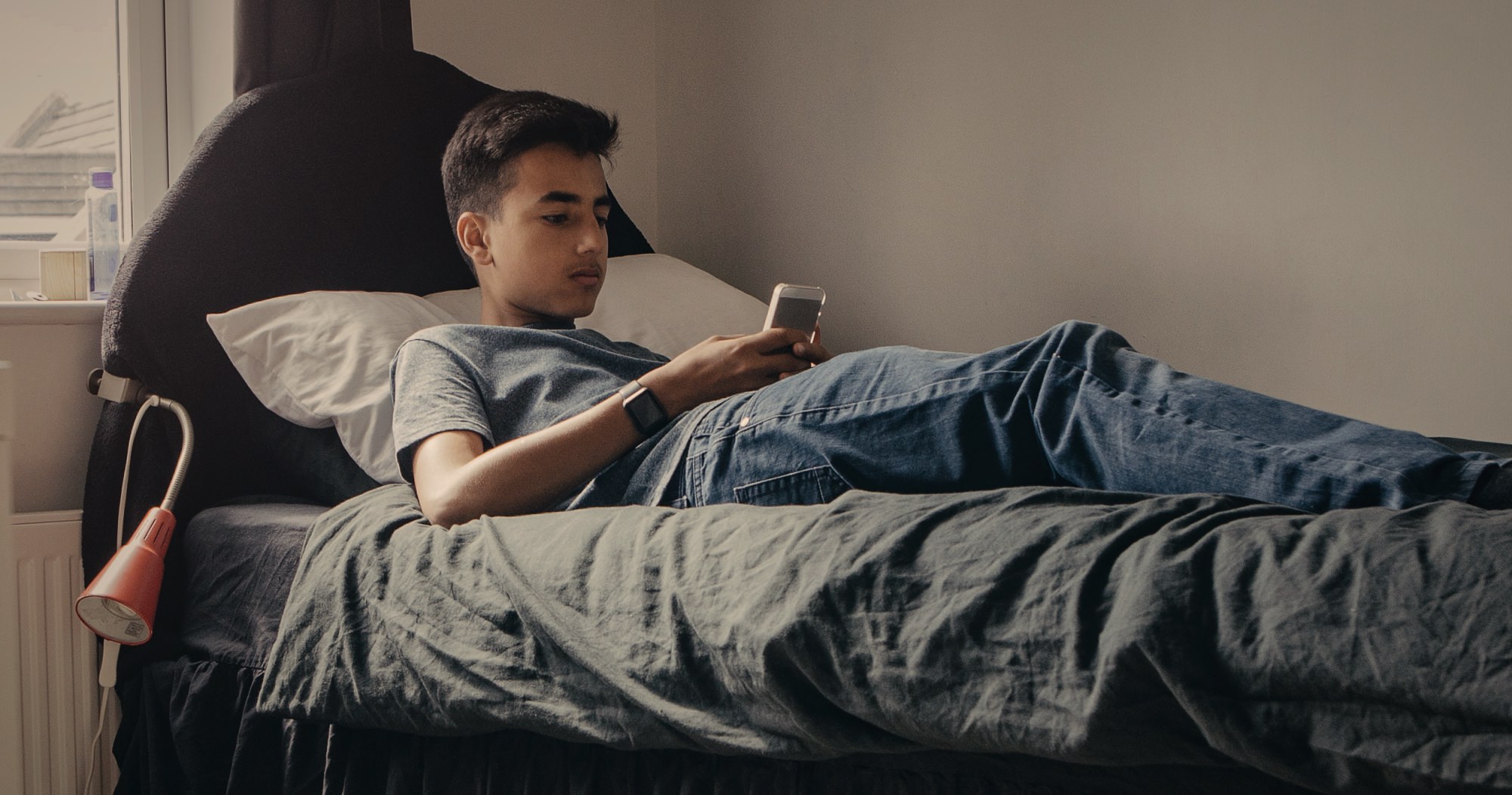 Teenager using Smartphone at Home